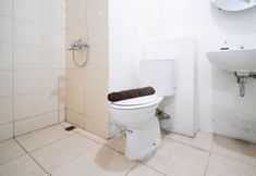 In-room Bathroom 5 Comfy 1BR Apartment at Tamansari Prospero Sidoarjo By Travelio