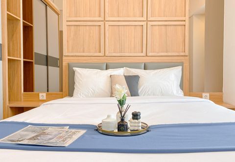 Bedroom Modern and Comfy 1BR at Vasanta Innopark Apartment By Travelio