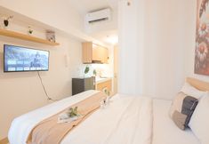 Bedroom 5 Compact and Simply Studio at Tokyo Riverside PIK 2 Apartment By Travelio