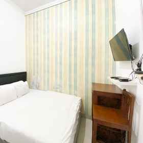 Bedroom1The Eco Village Homestay RedPartner,斯莱曼飯店