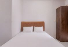 침실 4 Cozy and Chic Studio Apartment at Amazana Serpong By Travelio
