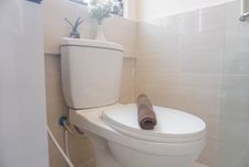 In-room Bathroom Modern Style and Warm 2BR at Meikarta Apartment By Travelio