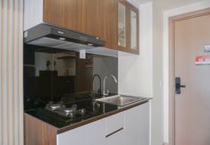 Common Space 6 Modern Style and Warm 2BR at Meikarta Apartment By Travelio