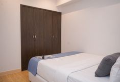 Bedroom 2 Minimalist and Comfy 1BR Apartment Branz BSD City By Travelio