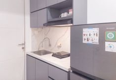 Common Space 7 Homey and Relaxing Studio at Urbantown Serpong Apartment By Travelio