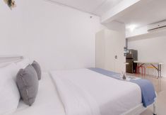 Bedroom 5 Homey and Relaxing Studio at Urbantown Serpong Apartment By Travelio