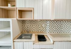 Common Space 7 Good Choice and Restful Studio at Tamansari Papilio Apartment By Travelio