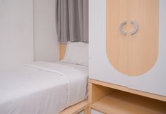 Bedroom 2 Minimalist and Comfy 2BR at Asatti Apartment By Travelio