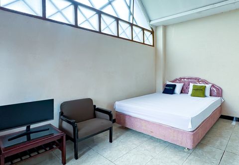 Bedroom Urbanview Hotel AR Cottage Gambung