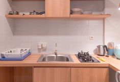 Common Space 5 Homey and Good Place 2BR Asatti Apartment By Travelio