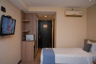 Bedroom 4 Minimalist and Warm Studio (No Kitchen) at Great Western Apartment By Travelio