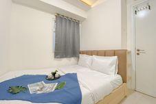 Bedroom Comfy and Good Deal 2BR Apartment Green Pramuka City By Travelio