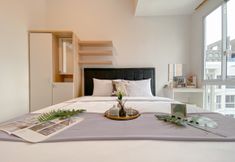 Bedroom 2 Best Furnished and Nice Studio at 39th Floor Tokyo Riverside PIK 2 Apartment By Travelio