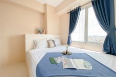 Exterior Strategic and Comfy 1BR with Extra Room at Bassura City Apartment By Travelio