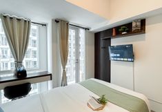 Bedroom 4 Tidy and Comfort Studio at Tokyo Riverside PIK 2 Apartment By Travelio