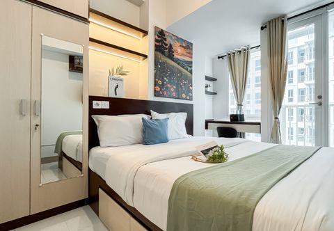 Bedroom Tidy and Comfort Studio at Tokyo Riverside PIK 2 Apartment By Travelio