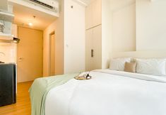 Bedroom 4 Homey and New Studio at Floor 35th Tokyo Riverside PIK 2 Apartment By Travelio