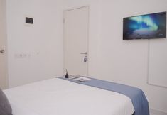 Bedroom 4 Cozy and Nice Studio (No Kitchen) at Apartment Aeropolis Residence By Travelio