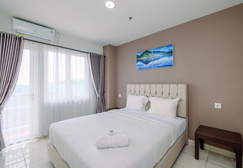 Bedroom Homey and Comfort 2BR at Sentul Tower Apartment By Travelio