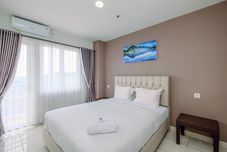 Bedroom Homey and Comfort 2BR at Sentul Tower Apartment By Travelio