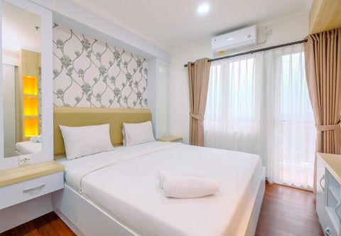 Bedroom Homey and Cozy Living 2BR Sentul Tower Apartment By Travelio