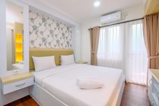 Bedroom Homey and Cozy Living 2BR Sentul Tower Apartment By Travelio