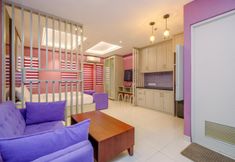 침실 5 Modern and Homey Studio at Sentul Tower Apartment By Travelio