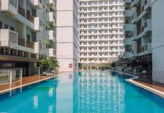 Swimming Pool 7 Modern Look and Enjoy 1BR at Sentul Tower Apartment By Travelio