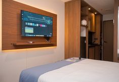 Bedroom 6 Cozy Studio at Sudimara Forestwalk Apartment By Travelio