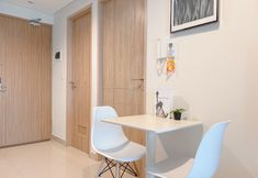 Common Space 5 Homey and Good Choice 2BR Apartment Tamansari Iswara By Travelio