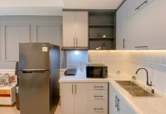 Common Space 4 Homey and Good Choice 2BR Apartment Tamansari Iswara By Travelio