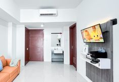 공용 공간 3 Homey and Modern 2BR Apartment with Space Room at Vittoria Residence By Travelio
