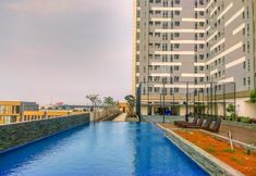 Swimming Pool 6 Best Choice Combined 2BR at Vasanta Innopark Apartment By Travelio