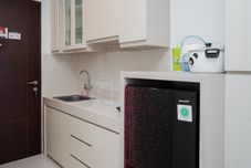 Common Space Nice and Comfort Studio Apartment at Springwood Residence By Travelio