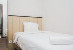 Bedroom 2 Cozy Stay and Warm 2BR Apartment at Springwood Residence By Travelio