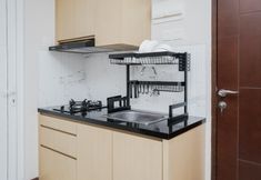 Common Space 4 Cozy Stay and Warm 2BR Apartment at Springwood Residence By Travelio