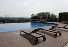 Lobby 6 Cozy Stay and Warm 2BR Apartment at Springwood Residence By Travelio