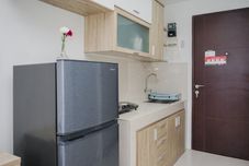 Common Space Cozy Studio Room Apartment at Springwood Residence By Travelio