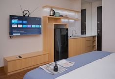 Bedroom 7 Cozy Studio Apartment at Atria Residence Gading Serpong By Travelio
