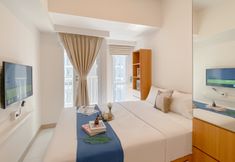 Bedroom 6 Minimalistic Comfort Studio at Tokyo Riverside PIK 2 Apartment By Travelio