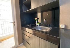 Common Space 7 Pleasurable and Enjoy 2BR Apartment Parahyangan Residence By Travelio