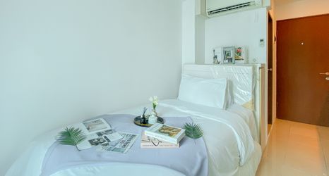 Bedroom 2 Minimalist and Comfy Studio Apartment at Tifolia By Travelio