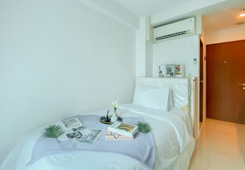 Bedroom Minimalist and Comfy Studio Apartment at Tifolia By Travelio