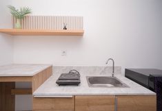 Common Space 5 Spacious Comfy Studio Room Apartment at Collins Boulevard By Travelio