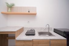 Common Space Spacious Comfy Studio Room Apartment at Collins Boulevard By Travelio