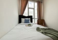 Bedroom 2 Comfortable and Spacious 3BR Apartment at Lucky Tower Residence By Travelio