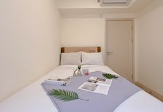 Bedroom 2 Comfortable 2BR Apartment with Extra Room at Meikarta By Travelio