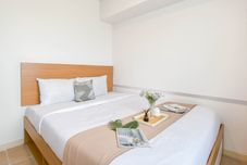 Bedroom Enjoy Living 2BR Apartment with Working Room at Meikarta By Travelio