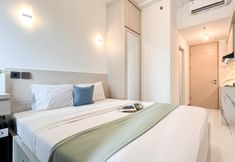 Bedroom 2 Homey Furnished and Restful Studio at Tokyo Riverside PIK 2 Apartment By Travelio