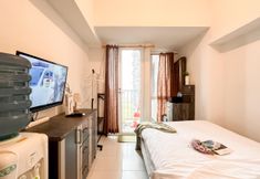 Bedroom 3 Relaxing and Good Furnished Studio at Tokyo Riverside PIK 2 Apartment By Travelio